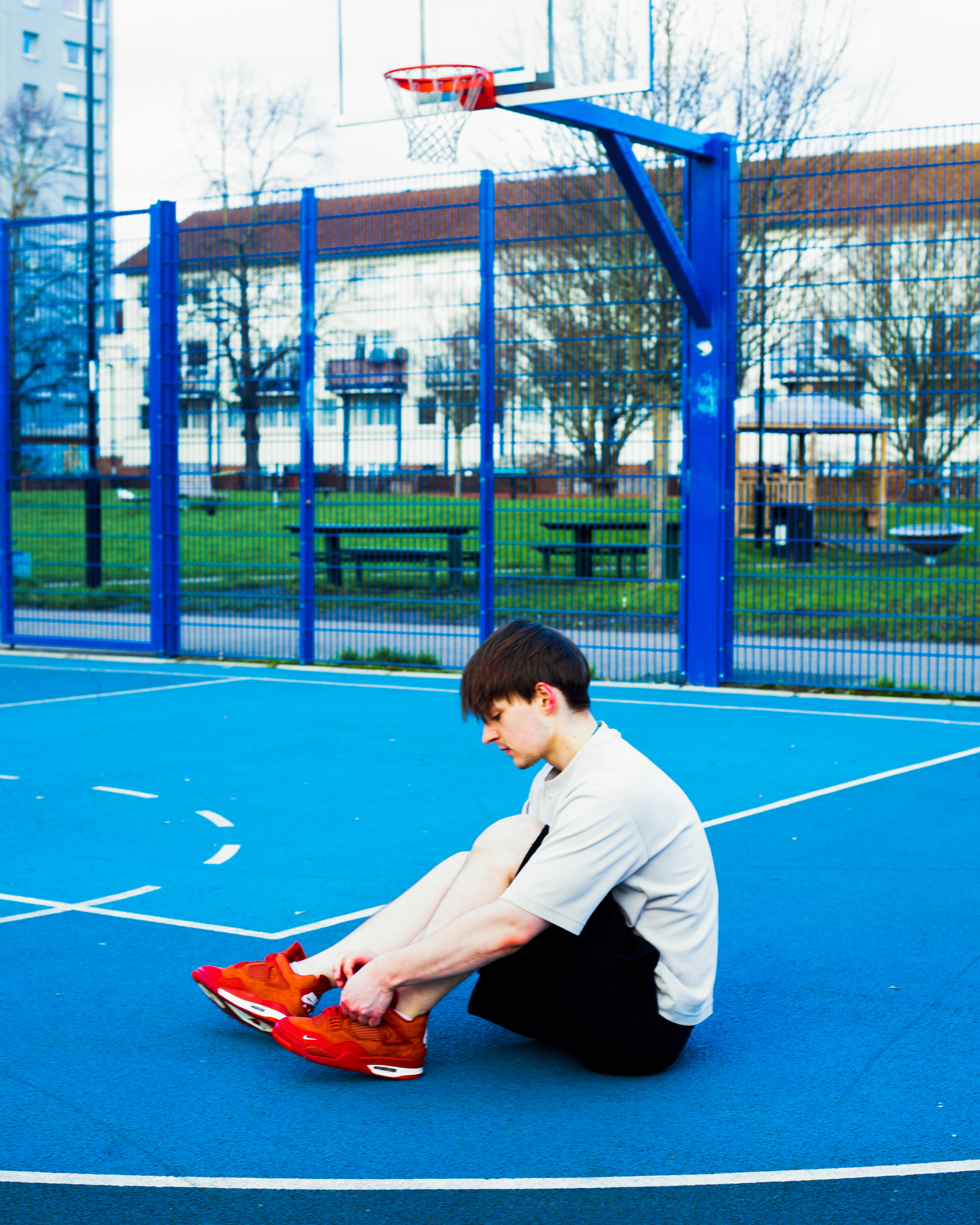 Basketball court with red sneakers